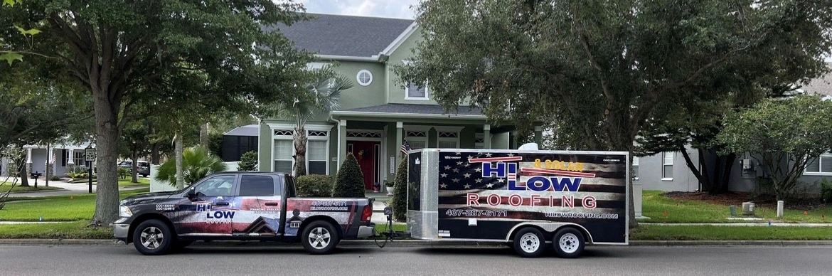 Hi Low Roofing’s branded truck and trailer outside a Central Florida home